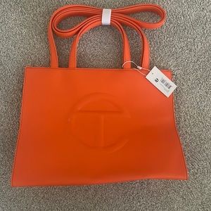 Hard to get orange Telfar bag. Medium orange shopping bag.